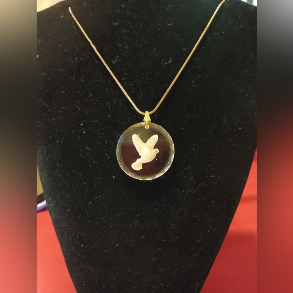 Flying white glass dove